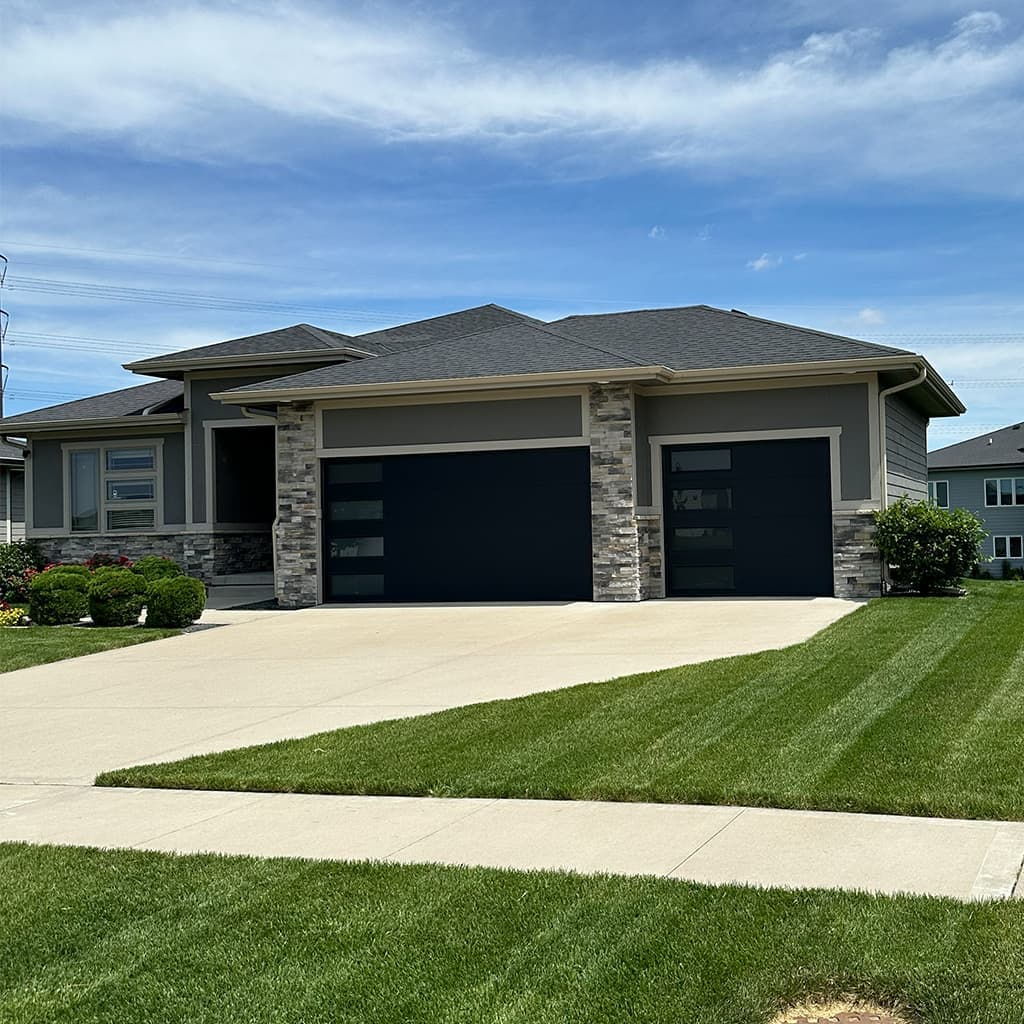 Lawn Legends mowing visit: tidy front yard with crisp string trim along beds and posts.